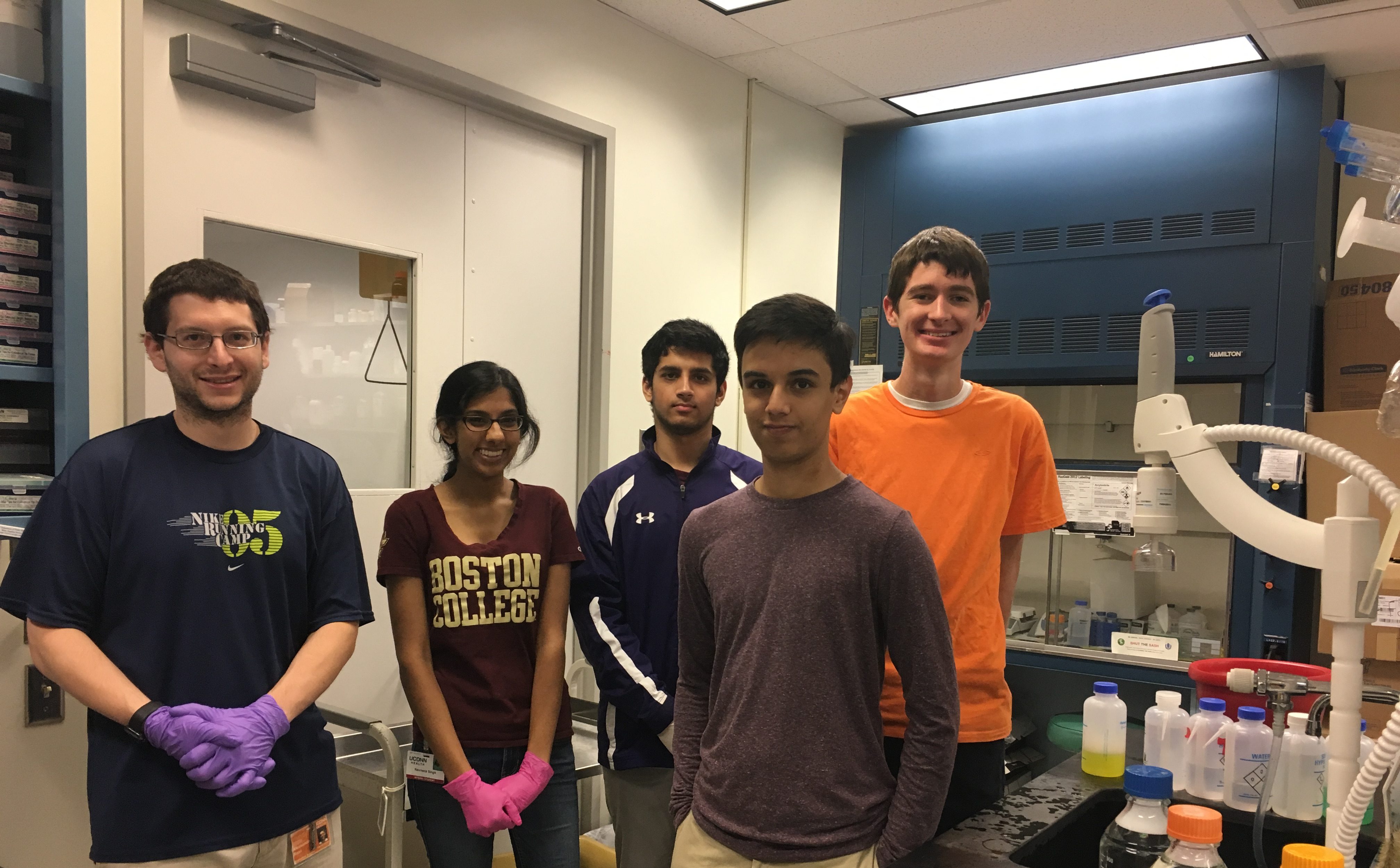 Alex Rizzo in the lab with Farmington High School Students