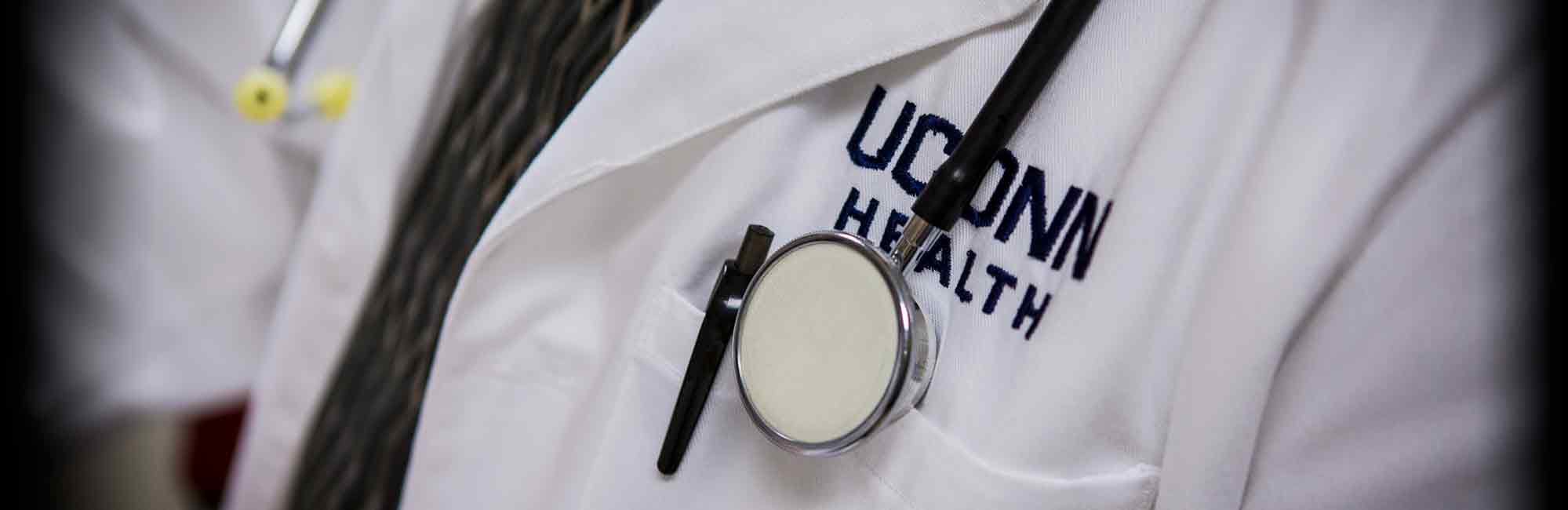 close up of UConn Health logo on lab coat