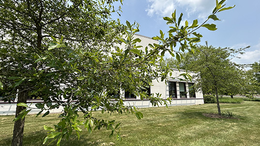 Outside 400 Farmington at UConn Health with building and trees in view. Image by S. Sarbipour.