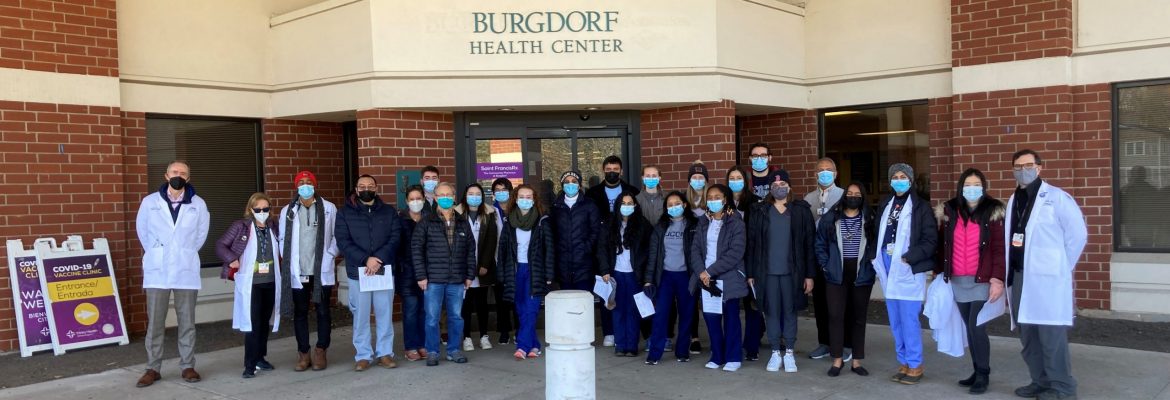 Bruce Gould, MD, and AHEC Scholars and other Health Professions Student Volunteers in front of Burgdorf Health Center