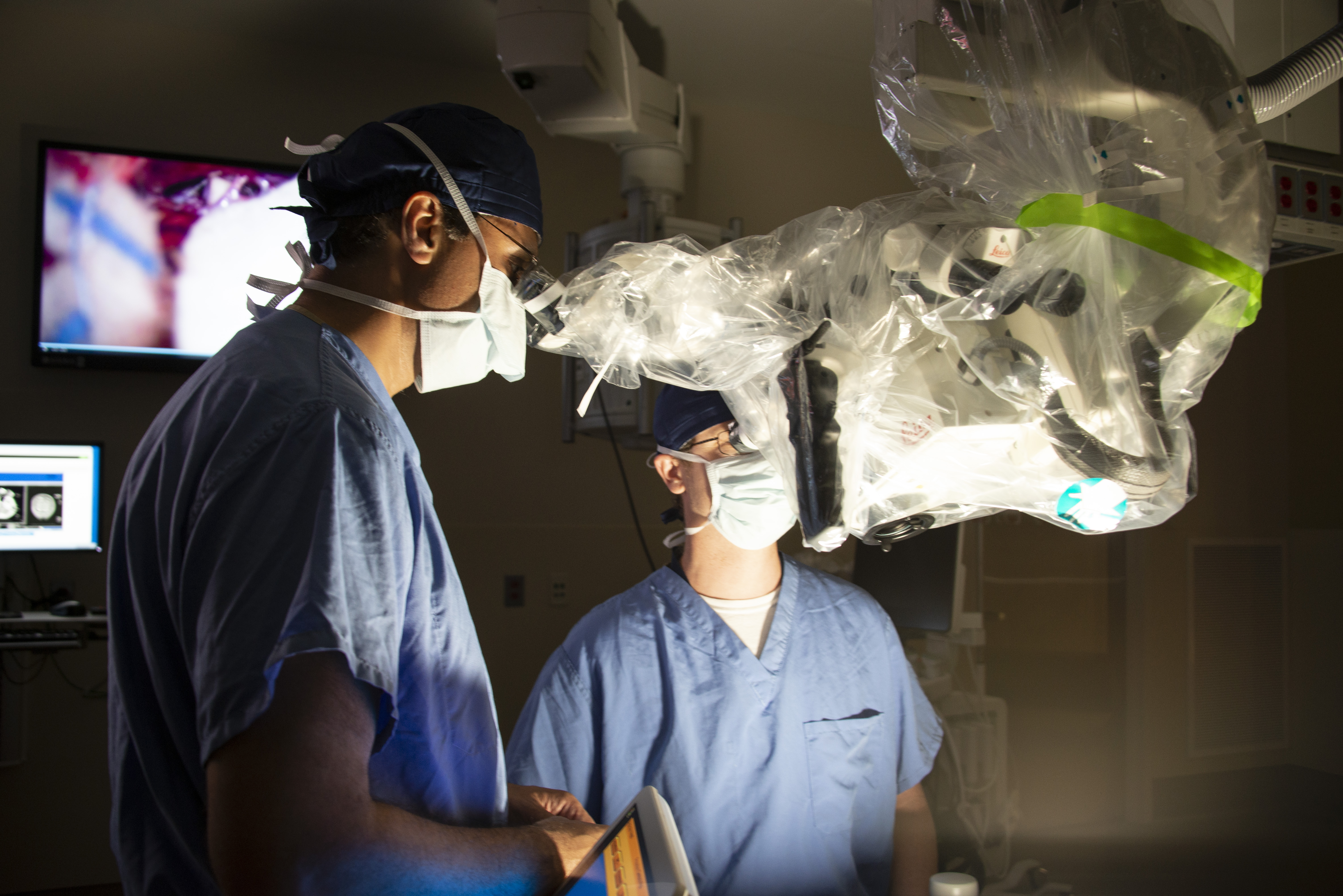 Ketan Bulsara, M.D., M.B.A, and Daniel Roberts M.D., Ph.D., with the Virtual Reality Microscope in the Hybrid OR at UConn Health