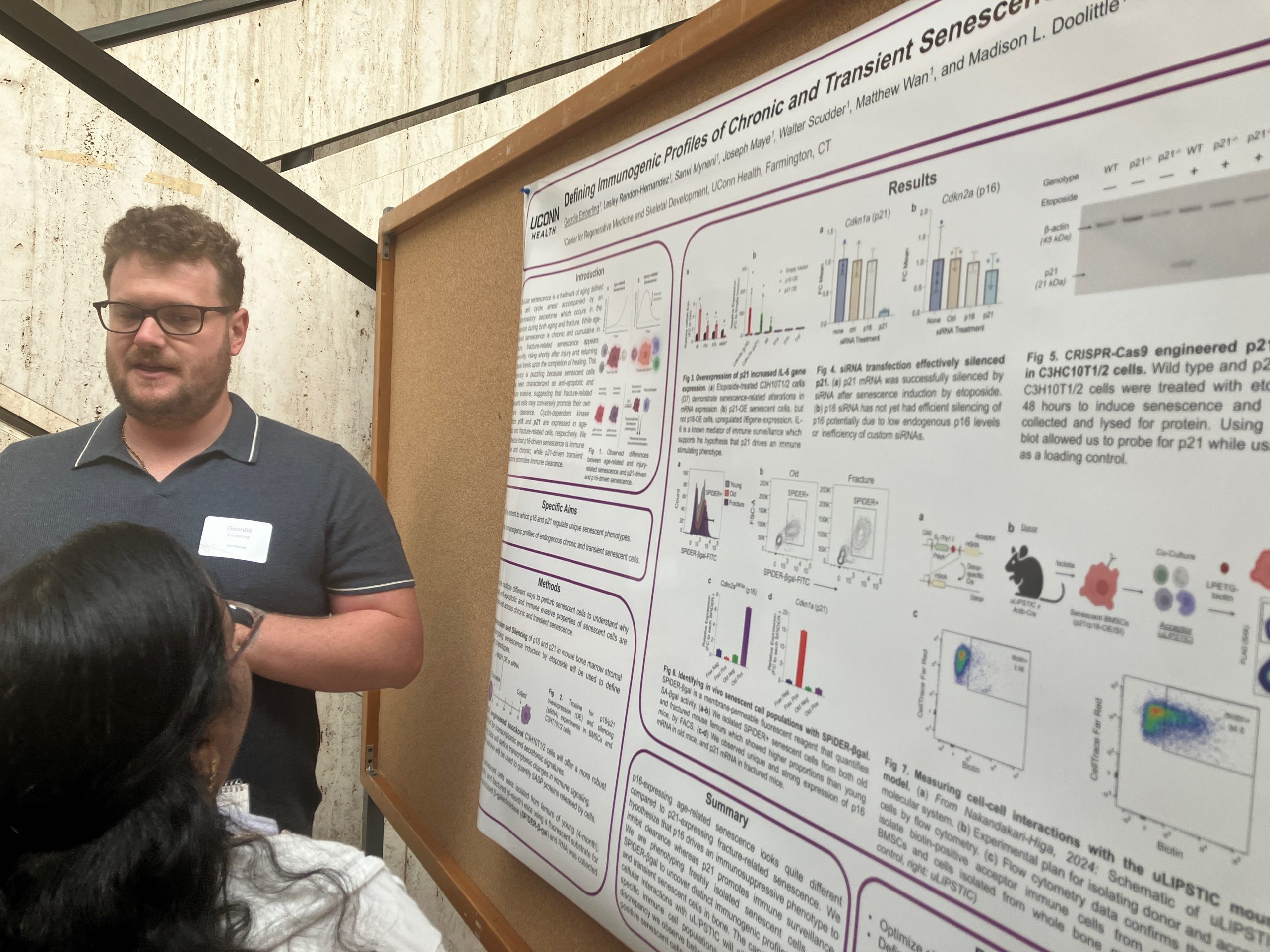 May 2026 Man presenting research poster