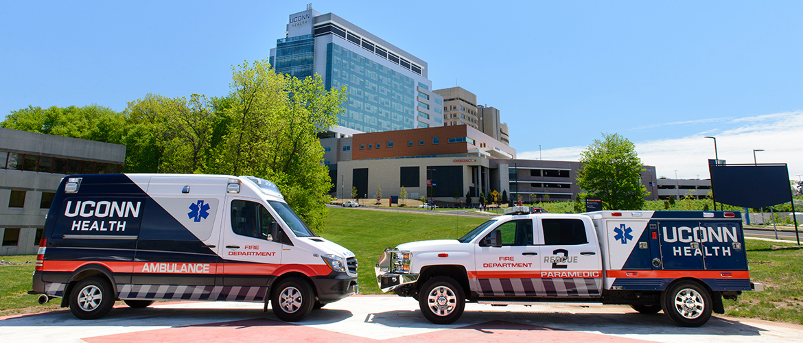 Ambulance and EMS truck on the UConn Health helipad in front of the new hospital tower and emergency room