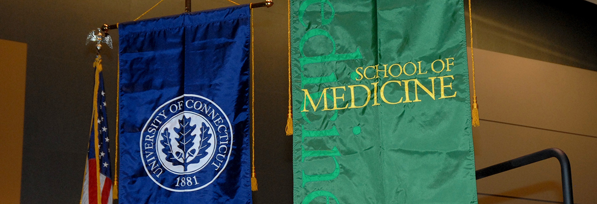 UConn and School of Medicine banners hanging at commencement