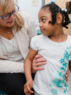 Doctor examining girl