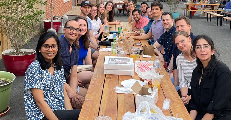 Groupof Fellows eating at table