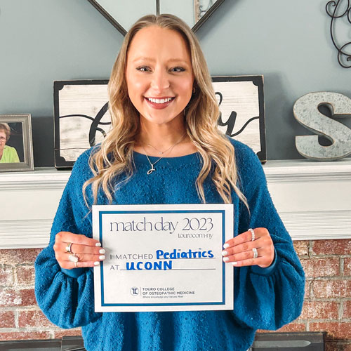 Jenna Scanlon holding a match sign