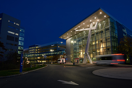 UConn Musculoskeletal Institute building with lights shining at night