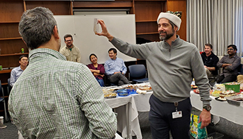 Anthony Vella, Ph.D., showing off the gift he got