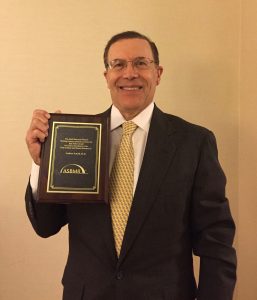 Dr. Andrew Arnold receiving the William F. Neumann Award.