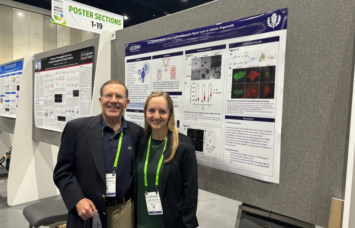 Caroline McNaboe presents her research on "An organoid model for investigating Lynch syndrome tumorigenesis." at the 2024 AACR in San Diego, CA. Pictured with her MD/PhD sponsor, Dr. Andrew Arnold.