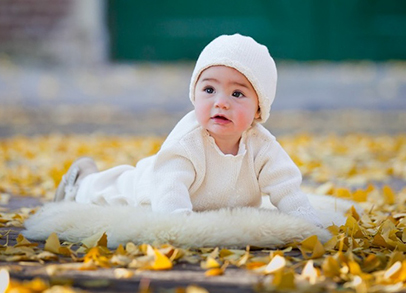 Baby with fall leaves