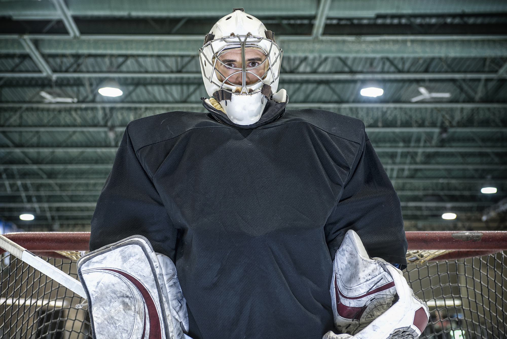 Hockey goalie standing near net