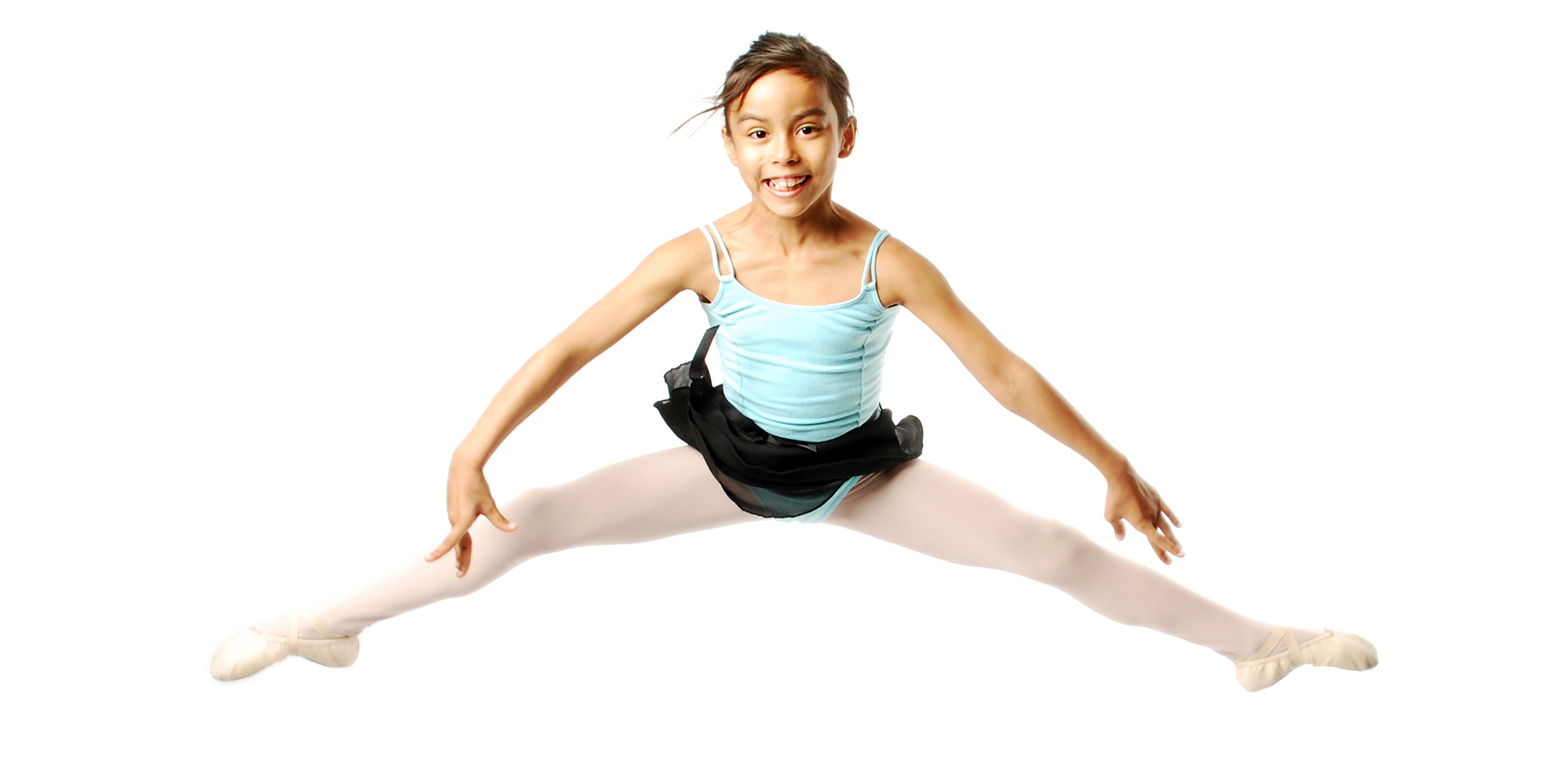 Young Ballerina Jumping on white background