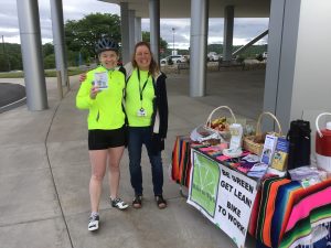 Host Joyce Fritz and biker enjoy the first Bike to Work celebration of 2018