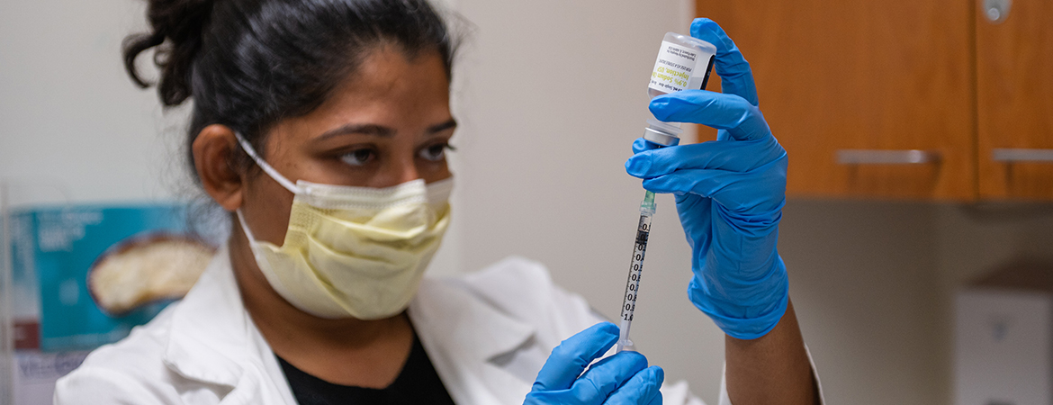 Close-up of Neha Prakash, M.D., preparing a syringe with botulinum toxin