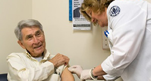 Photo of a physician and patient interacting.