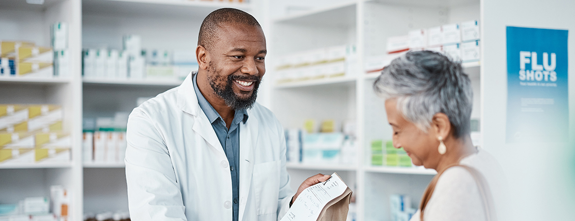 Pharmacist consulting with a customer about their prescription