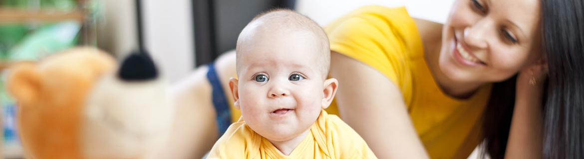 Baby with mom watching