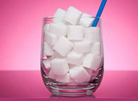 glass filled with sugar cubes