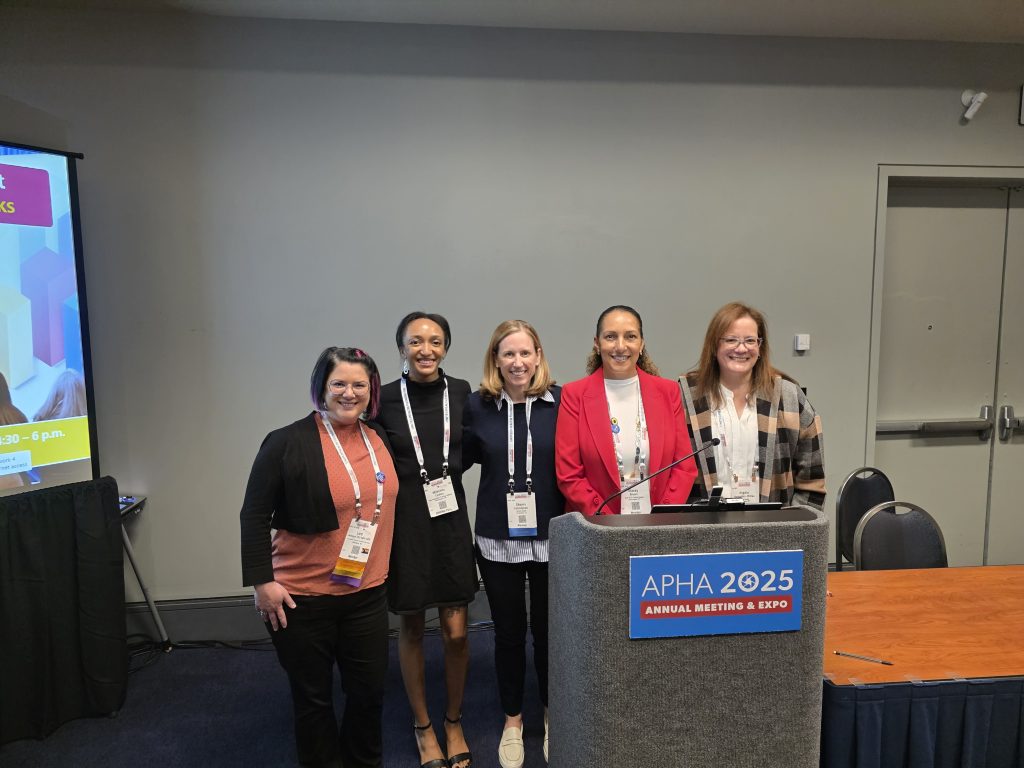 group photo of an APHA member, Makenna Lindsay, Shayna Cunningham, Dr. Stacey Brown, and Dr. Angela Bermudez- Millan