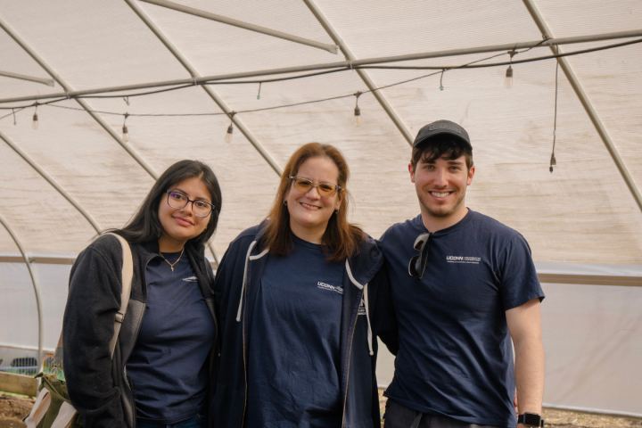 Angela Bermudez, Michael Raizin, and Lisbeth Moran with the greenhouse at Keney Park