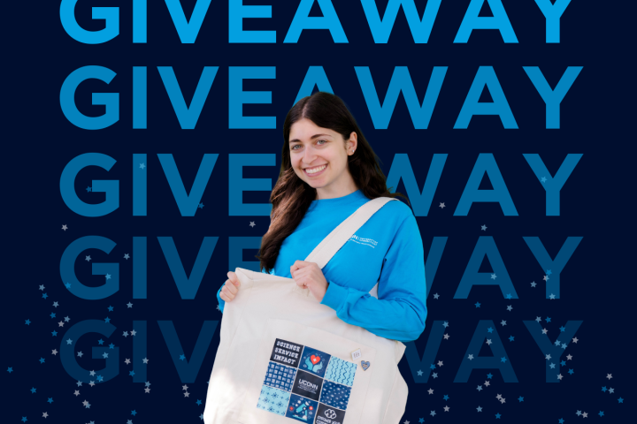 taline norsigian with a tote bag with the word giveaway behind her