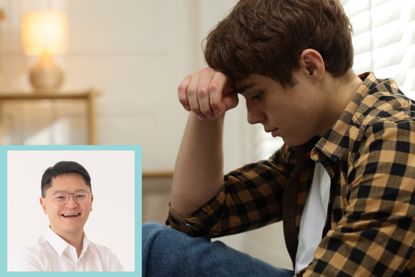 A teenage boy sits with his head resting on his hand, appearing distressed. An inset portrait of Dr. Greg Rhee appears in the lower-left corner.