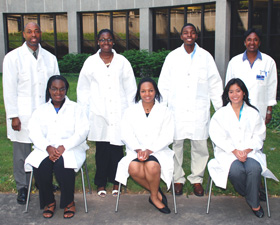 Five graduates from the Aetna HPPI Saturday Academy received scholarships to pursue undergraduate studies at UConn: (seated, from left) Kristen Springer, Faith Crittenden, Somaly Chhean, (standing, from left) HCOP Associate Director Granville Wrensford, Gian Grant, Javar Stephenson, and Dr. Marja Hurley, HCOP director.