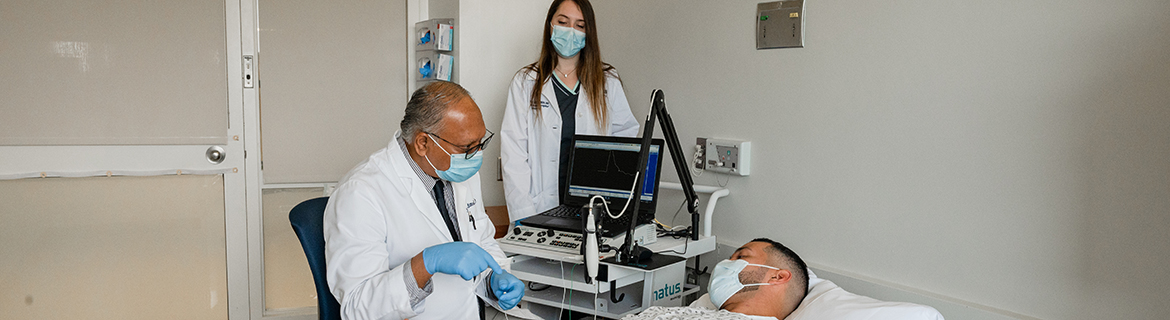 Sanjay Mittal, M.D., administers an injection of botulinum toxin to a patient