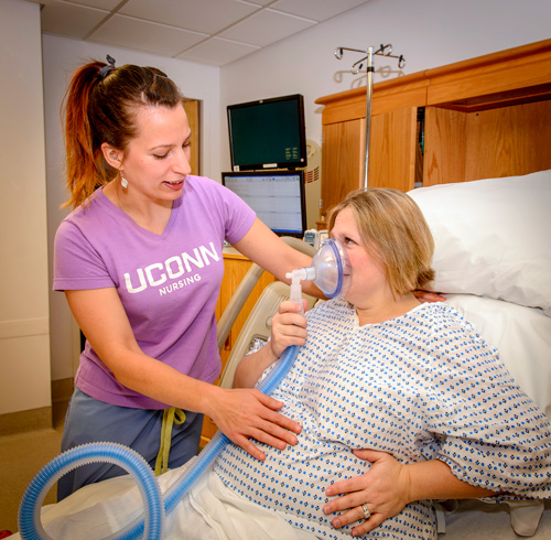 Mom utilizing nitrous oxide in labor