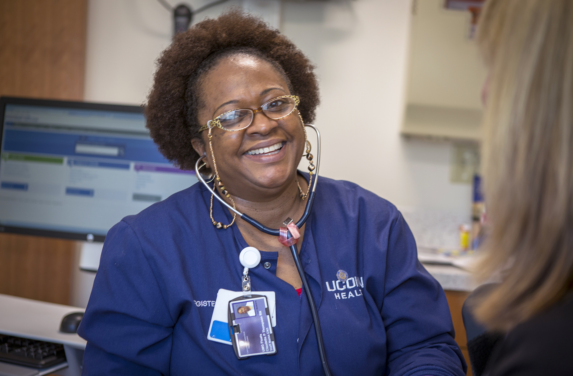 A nurse talks with a patient at UConn Health on Feb. 11, 2016. (Paul Horton/UConn Photo)