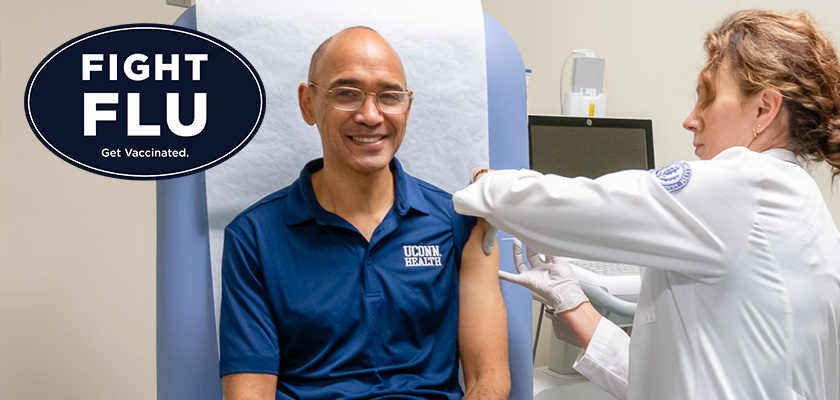 Dr. Andrew Agwunobi receiving his flu shot at UConn Health