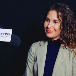 Dr. Rebecca Andrews at a microphone