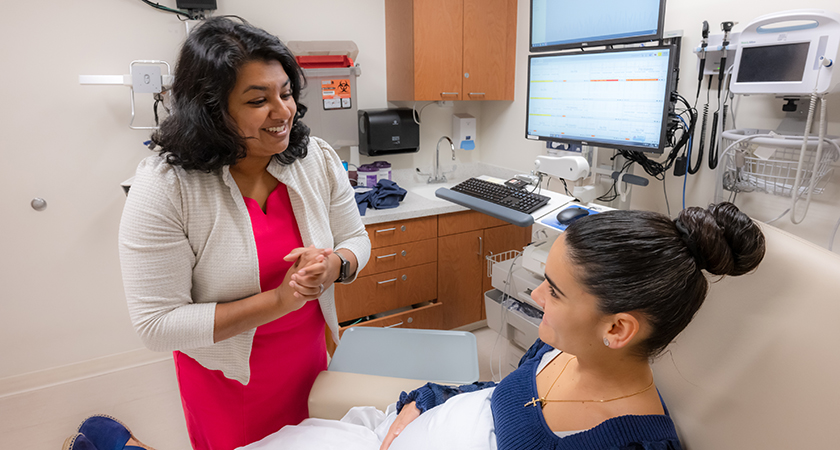 zachariah-roshini-20241106-7655_840x450 Roshini Zachariah, MD, an OB/GYN specializing in maternal-fetal medicine, meets with a patient in an Outpatient Pavilion exam room